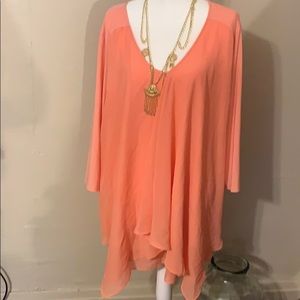 Peach colored blouse
